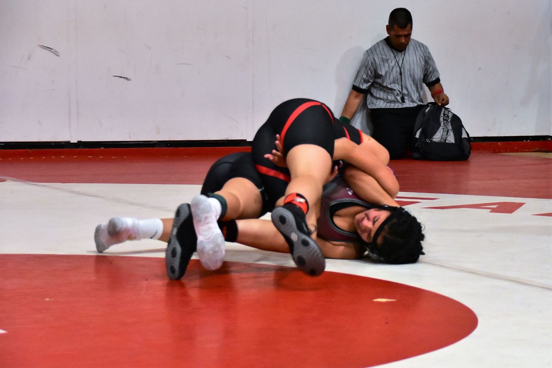 Santa Maria's Destiny Garcia working to pin Nipomo's Savanah Ruiz